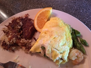 I was beyond adventurous in my breakfast choice, I had a shrimp and asparagus omelet, if you can see I was so excited to dig in I got a picture after I'd eaten half.